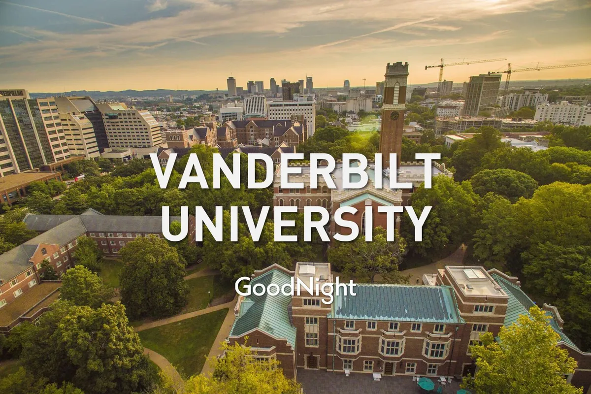 A serene, wide-angle view of Vanderbilt University’s iconic clock tower rising above a green campus, with the surrounding cityscape in the background. The scene exudes an academic and inspirational vibe, ideal for illustrating the area’s proximity to renowned universities.